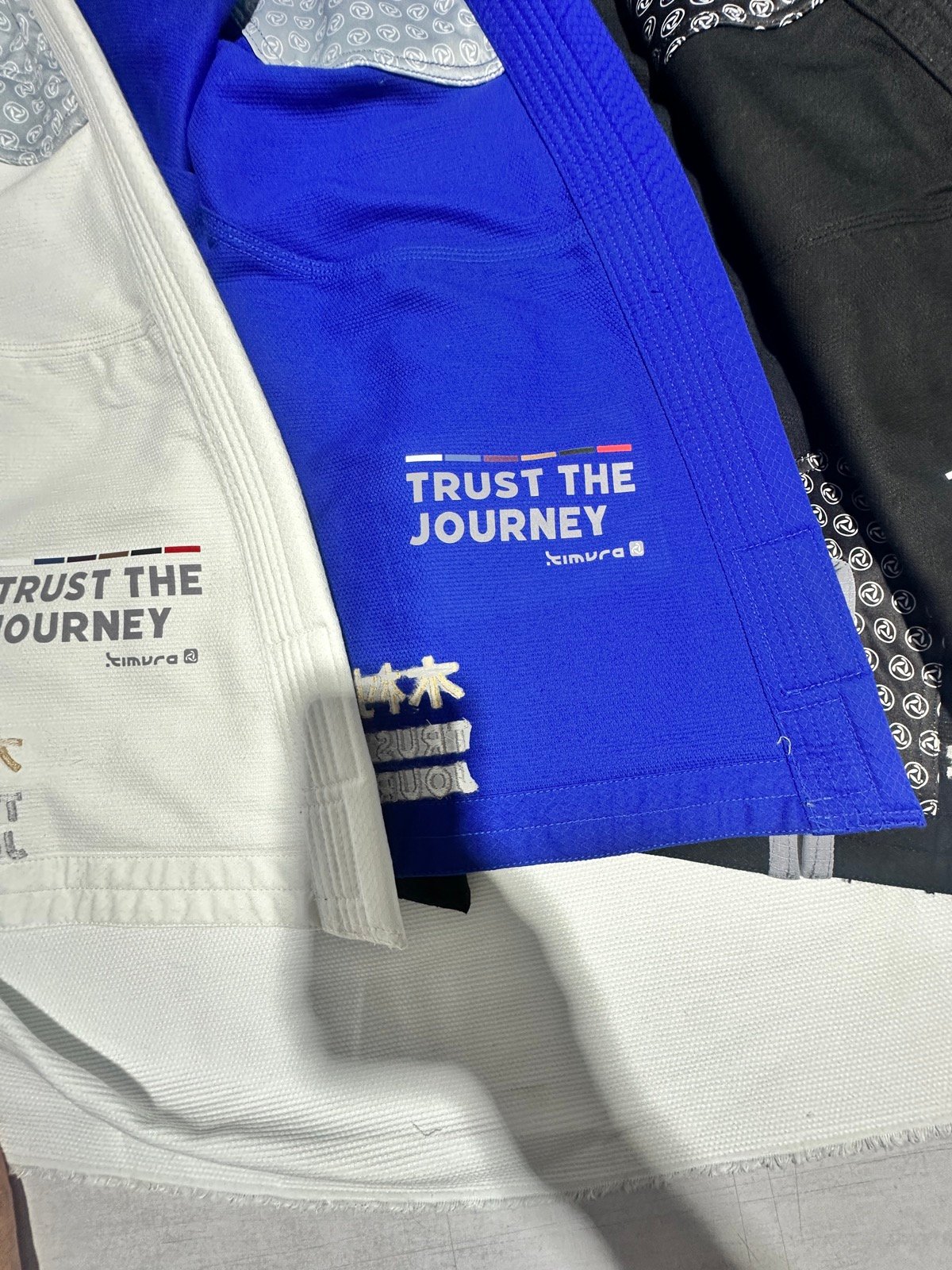 Wholesale Brazilian jiu-jitsu gis in white, royal blue and jet black ready for retail